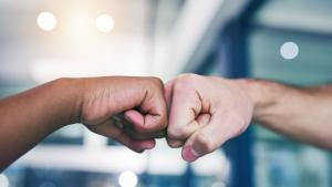 Two hands in a fistbump position